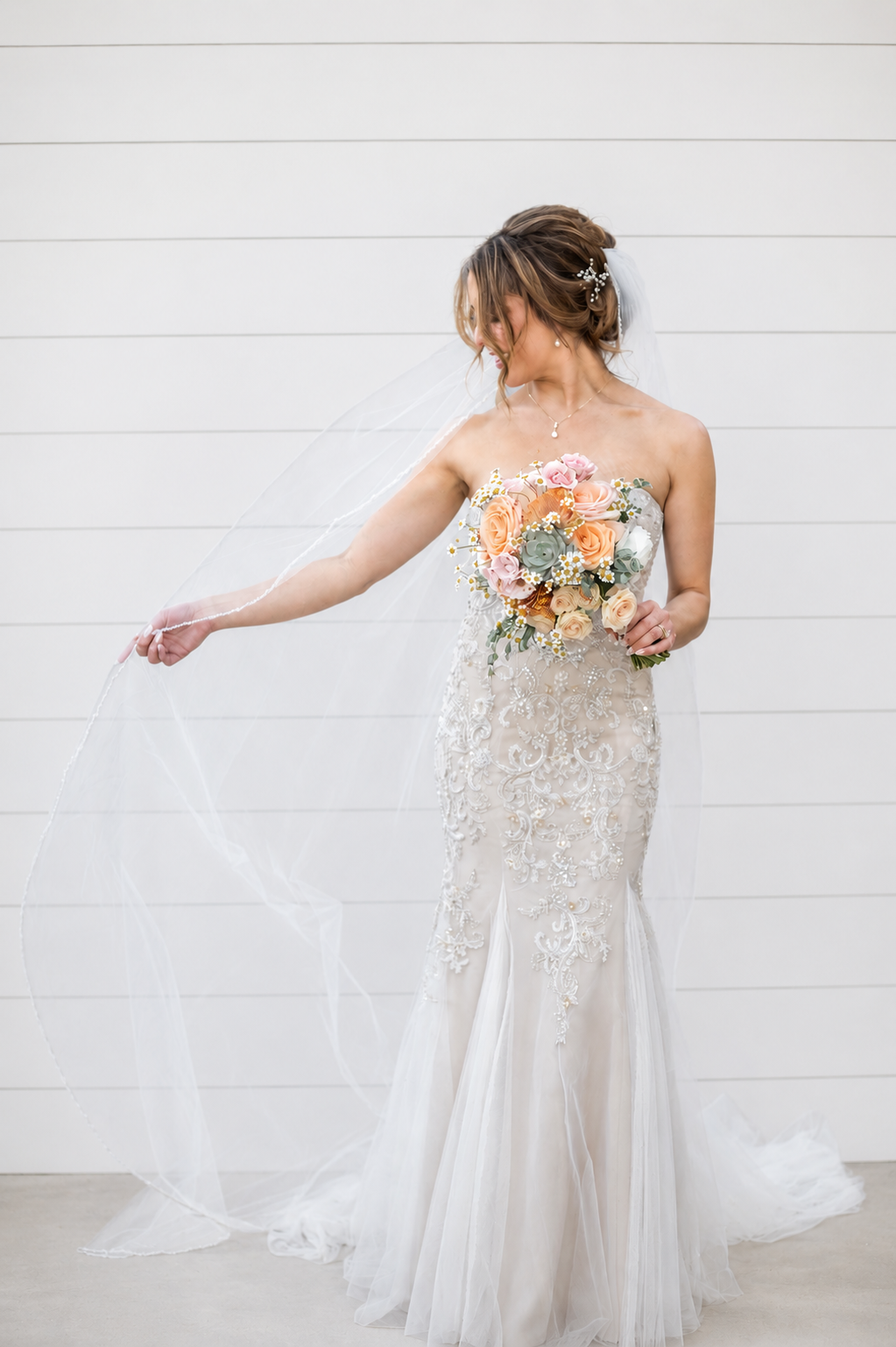 bride showing her wedding dress